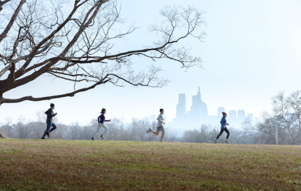 four people running outdoors