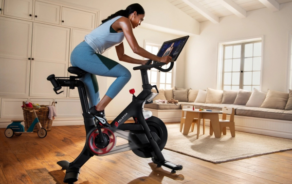 person on a stationary bike in a living room